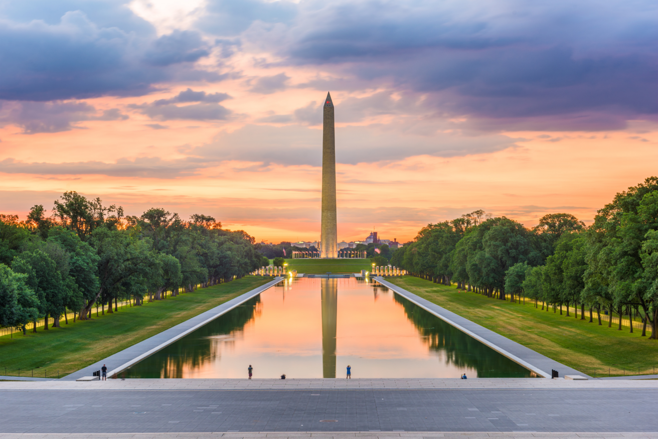 The Washington Monument at sunset, seen from the Lincoln Memorial, with its reflection in the Reflecting Pool in Washington, D.C.