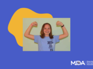 A child wearing a light blue MDA shirt poses with arms flexed on a blue background with the Muscular Dystrophy Association (MDA) logo.