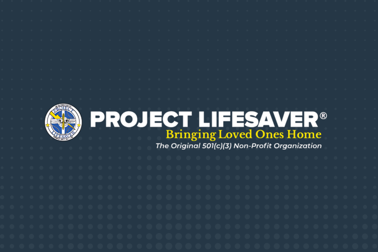 Project Lifesaver logo with the slogan "Bringing Loved Ones Home" and "The Original 501(c)(3) Non-Profit Organization" on a dark blue dotted background.