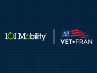 101 Mobility and VetFran logos displayed side by side on a dark dotted background.