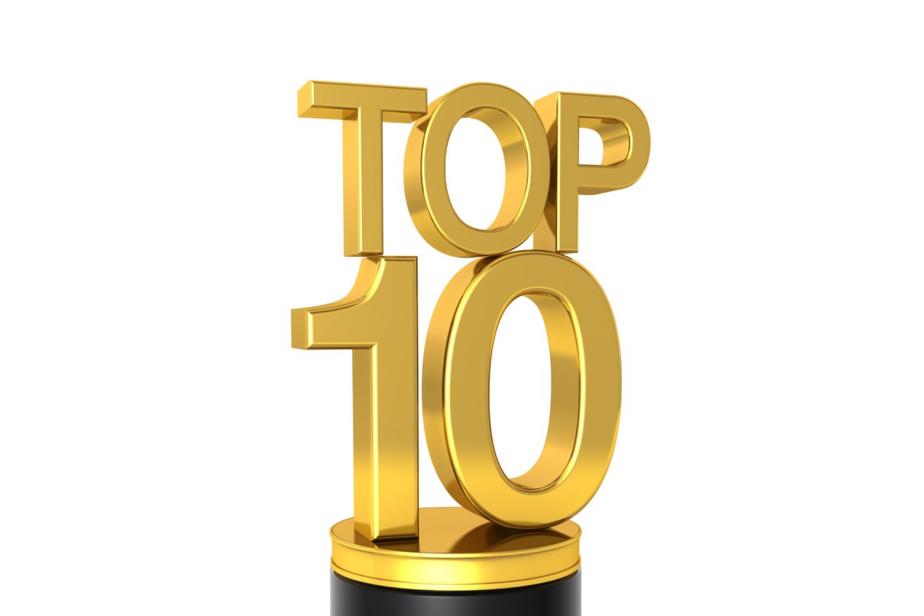 A gold "Top 10" trophy with shiny metallic text sits on a black base.