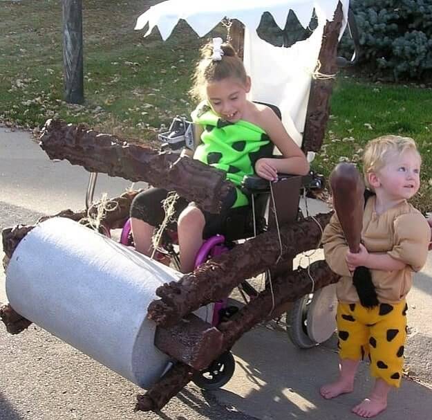 flintstones designed wheelchair and two kids