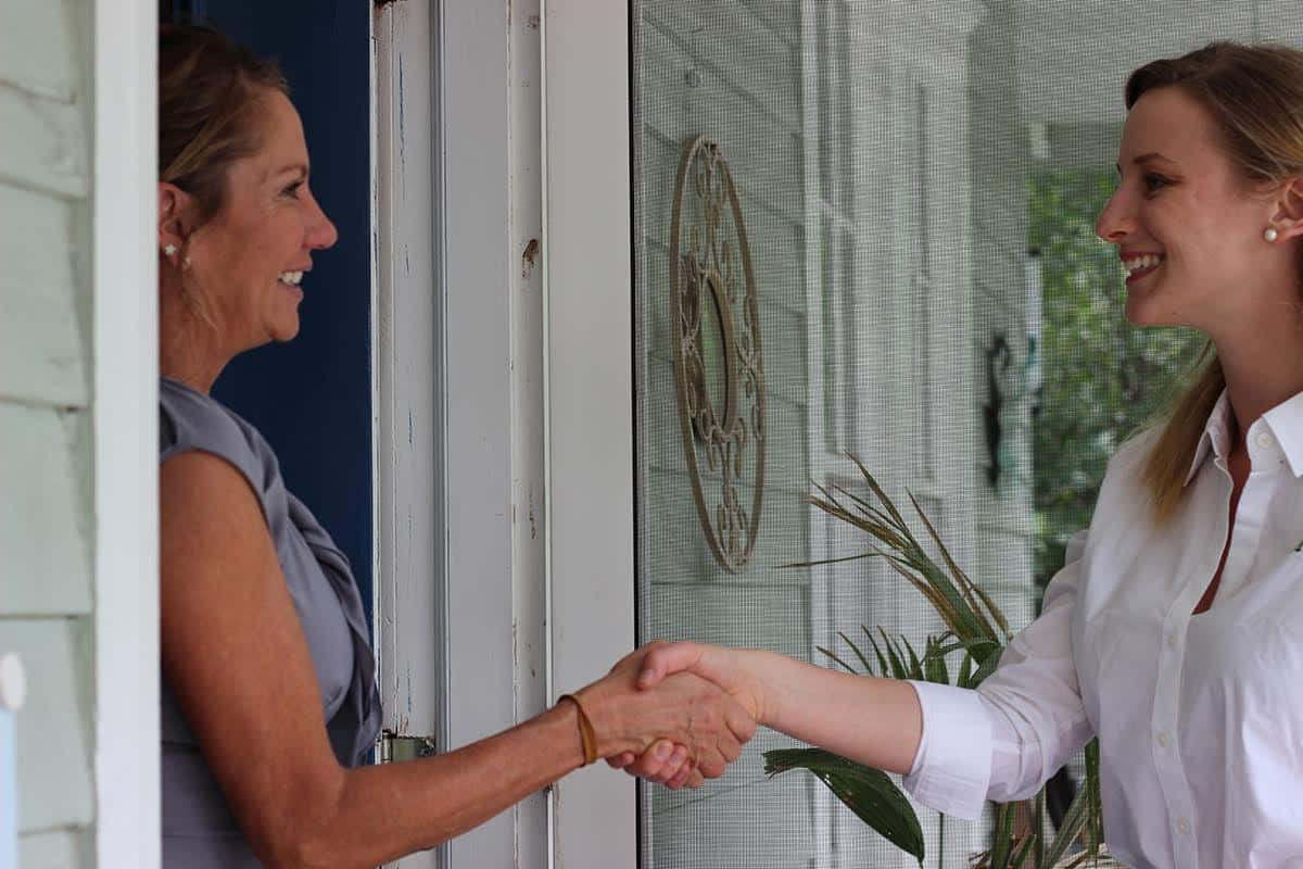 two girls shaking hands