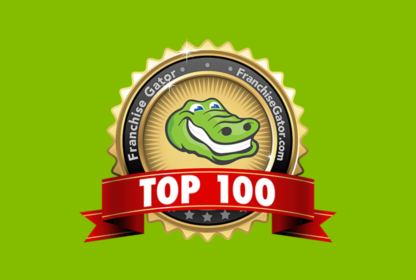 A badge with a smiling alligator and the text "Franchise Gator" encircling it. A red ribbon across the bottom reads "TOP 100." The background is green.