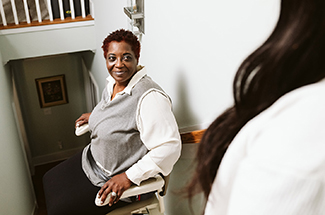 Woman on the stairlift