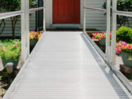 aluminum modular ramp in front of a house door.