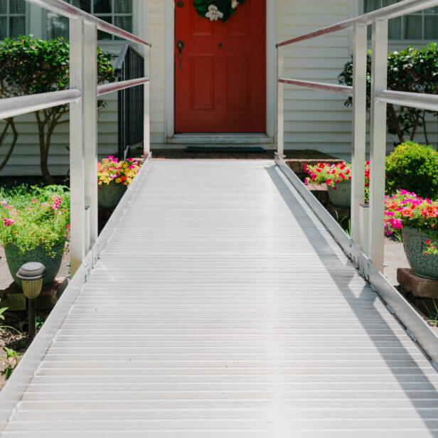 aluminum modular ramp in front of a house door.