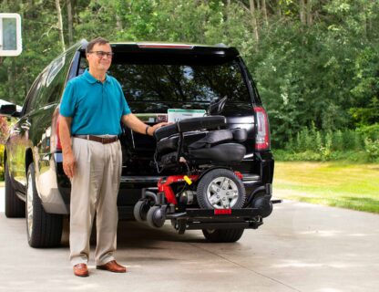 bruno outsider SUV man lowering powerchair.