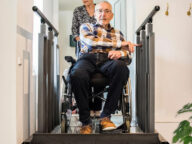 a man using a flexstep by liftup vertical platform lift.