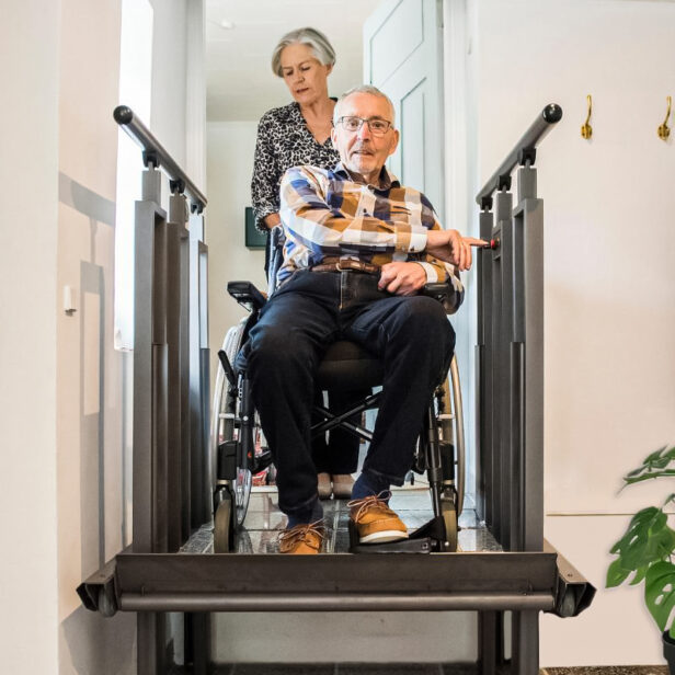 a man using a flexstep by liftup vertical platform lift.