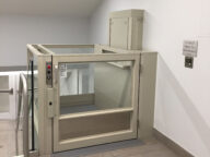 Savaria V-1504 vertical platform lift in a lobby.