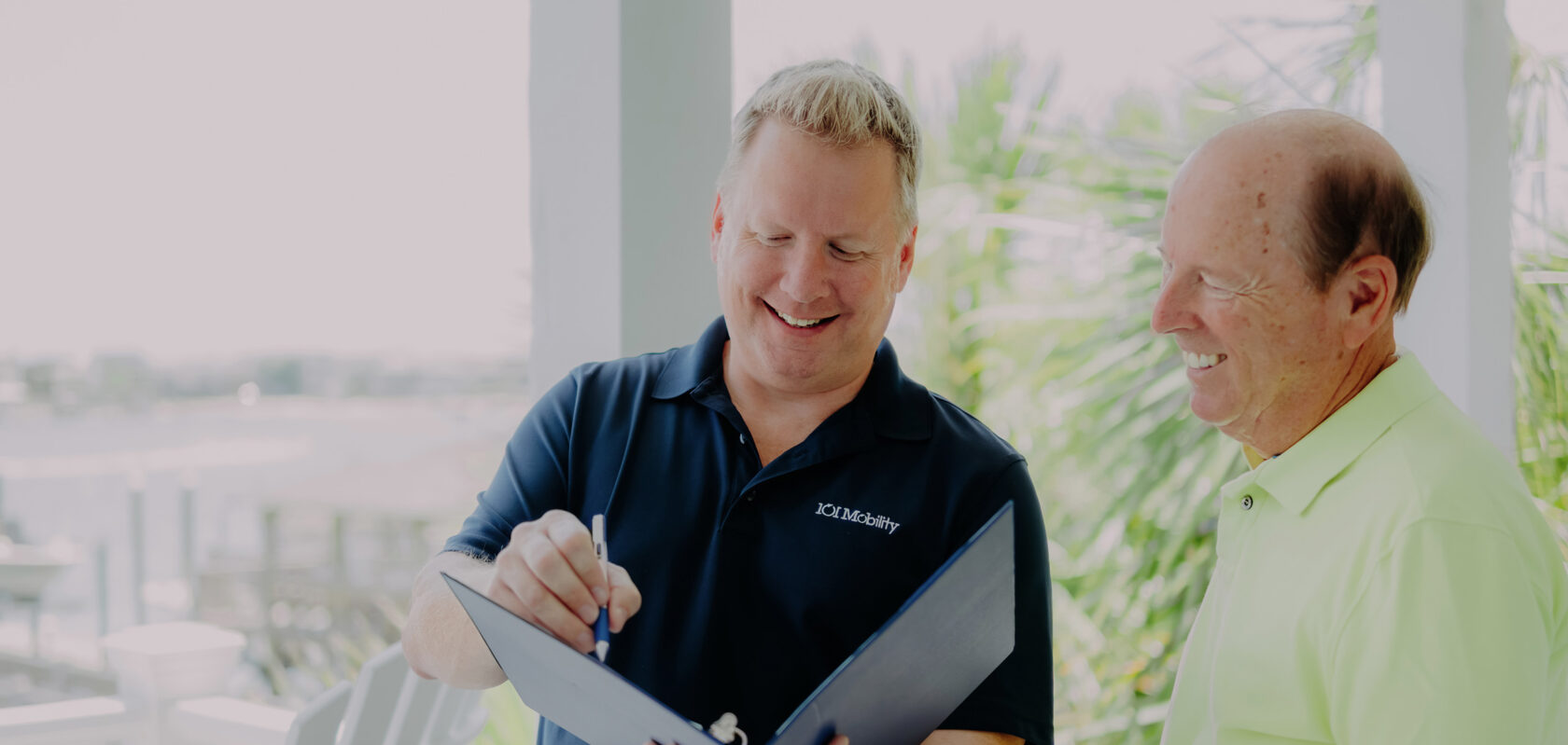 a 101 mobility staff member doing an in-home consultation for a client.