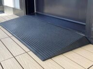 a close up view of a rubber threshold ramp.