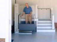 a man using a bruno vertical platform lift.