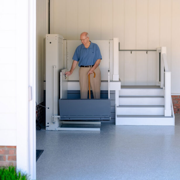 a man using a bruno vertical platform lift.