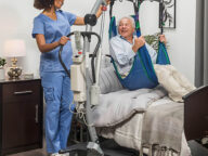 a patient on a levanto floor lift.