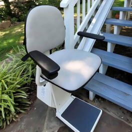 close up view of the seat on a staying home outdoor stairlift.