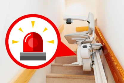 Stairlift on a staircase with a red warning siren graphic indicating an alert or caution.